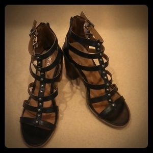 Gladiator style stacked heel sandals.